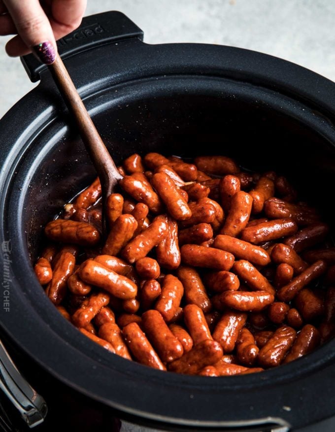 Spoonful of bbq little smokies in the crockpot