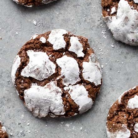 Fudgy and moist, these Chocolate Crinkle Cookies are a wonderful combination of cookies and brownies, and all with that classic crackly top that makes them a favorite for Christmas baking! #cookies #crinkle #Christmas #cookietray #chocolate #brownie #baking #dessertrecipe #cookierecipe #holidaybaking