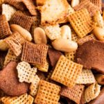 Always a crowd pleaser, this bold and zesty chex mix recipe is made SO simply, right in the crockpot!  Great for any party, and easy to customize! #chexmix #party #snackrecipe #partyfood #bold #chex #slowcooker #crockpot #easyrecipe #homemade