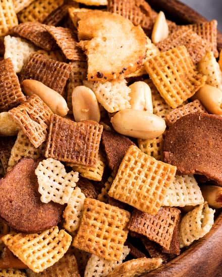 Always a crowd pleaser, this bold and zesty chex mix recipe is made SO simply, right in the crockpot!  Great for any party, and easy to customize! #chexmix #party #snackrecipe #partyfood #bold #chex #slowcooker #crockpot #easyrecipe #homemade