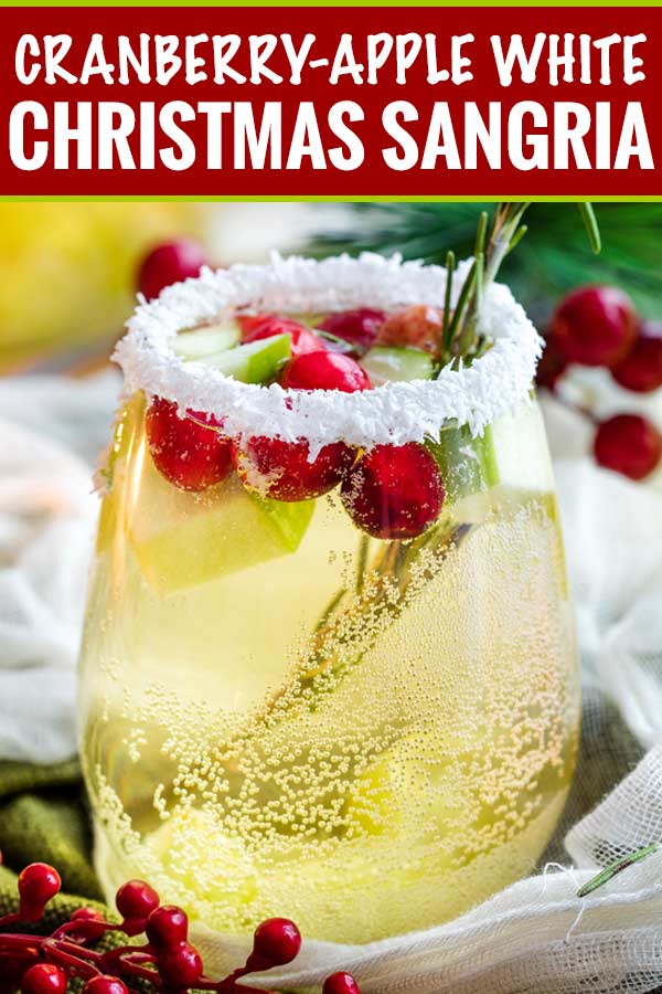 Sweet and festive, this white sangria recipe is full of Christmas cheer!  Easy to make for holiday entertaining, and can be made non-alcoholic as well! #sangria #white #christmas #holiday #winter #alcohol #drink #party #whitewine