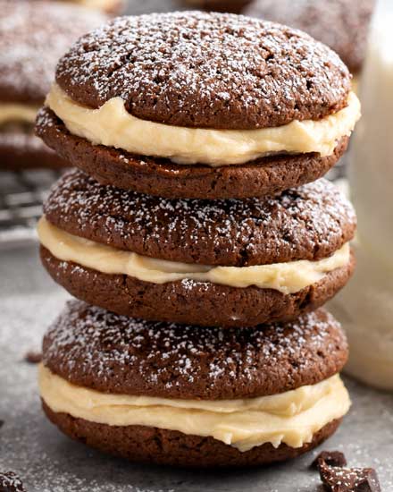 These whoopie pies are packed with classic Italian dessert flavors.  Soft and fluffy chocolate espresso cookies, sandwiched with a rich mascarpone kahlua frosting! #whoopiepies #cookierecipe #cookies #tiramisu #dessertrecipe #sandwichcookie #espresso #kahlua