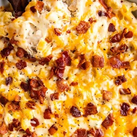 Delicious combo of chicken, bacon, ranch, and a mac and cheese made with three cheeses!  Family-friendly, make-ahead friendly, and perfect for a weeknight dinner! #macandcheese #chickenbaconranch #crackchicken #bakedmac #macaroniandcheese #easyrecipe #weeknightdinner #casserole