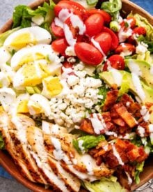 This classic Cobb salad is made with seared chicken breasts, crunchy bacon, sweet tomatoes, creamy hard-boiled eggs, buttery avocado and drizzled with a fantastic and low-carb homemade ranch dressing! Perfect for Keto and low-carb living! #salad #cobb #lowcarb #keto #healthyrecipe #saladrecipe #ranchdressing #homemade #easyrecipe