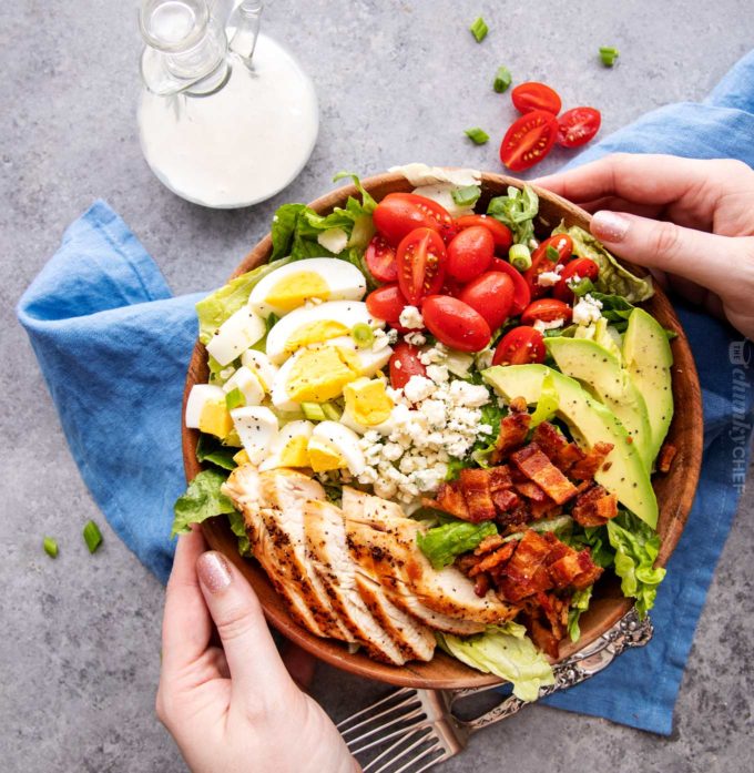 Holding a bowl of keto Cobb salad