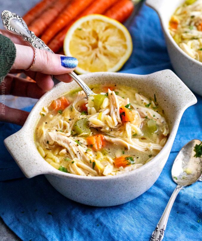 Spoonful of chicken soup with orzo