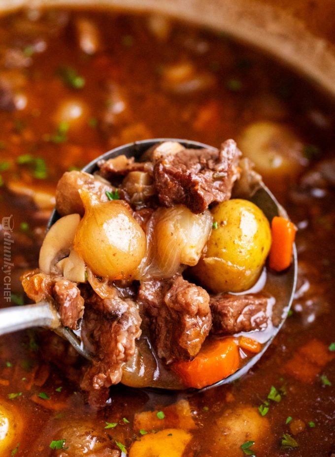 Crockpot Beef Bourguignon has melt in your mouth beef and hearty vegetables simmered all day in a rich red wine gravy!  The ultimate winter comfort food!  Slow cooker, oven, stovetop and instant pot directions! #beefstew #beefbourguignon #slowcooker #crockpot #comfortfood #dinner #easyrecipe #beef