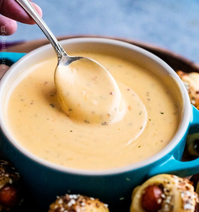 Just like the beer cheese from your favorite pub, this easy beer cheese sauce is made in 15 minutes or less, and PERFECT for dipping or topping your favorite foods! #beer #cheese #beercheese #appetizer #party #dip #sauce #gameday #easyrecipe