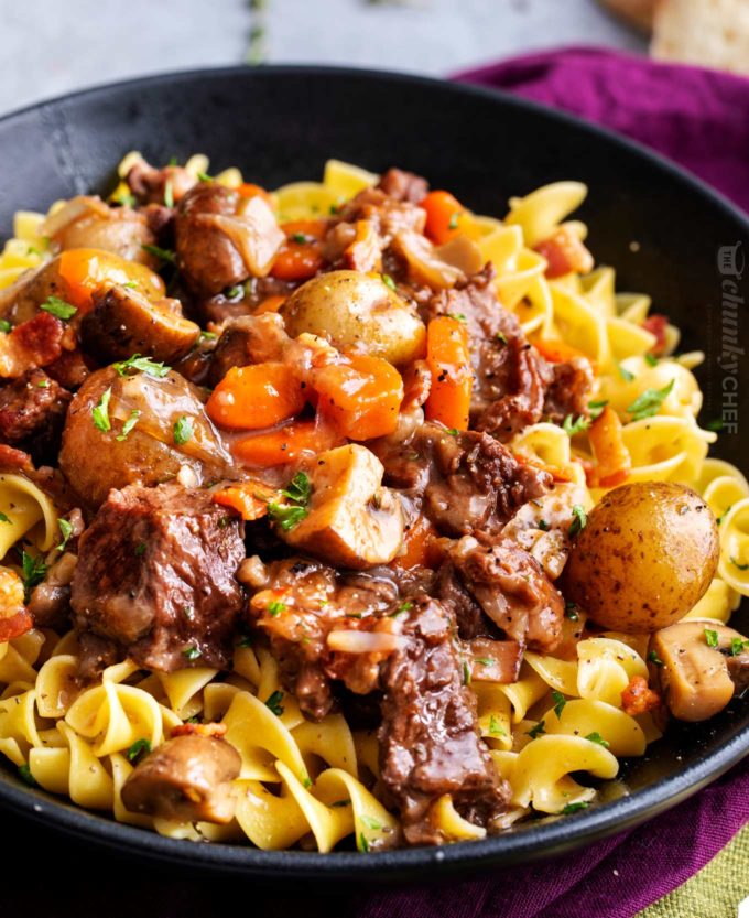 Beef bourguignon over egg noodles