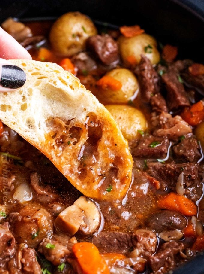 Bread dipped in beef bourguignon