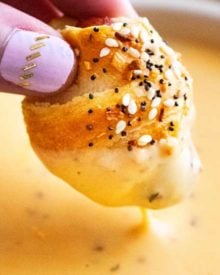 Classic pigs in a blanket, made with cocktail franks and flaky crescent rolls, baked with sprinkle of savory "everything" bagel seasoning! Always a crowd-pleaser, make these 4 ingredient gems for your next party! #pigsinablanket #crescentrolls #lilsmokies #everything #bagelseasoning #appetizer #partyfood #easyrecipe
