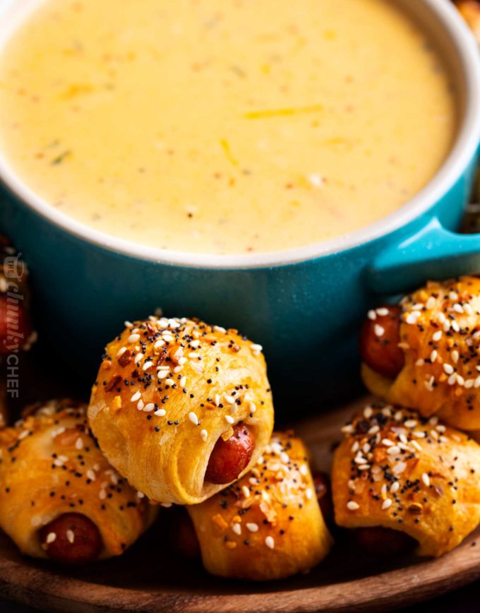 Classic pigs in a blanket, made with cocktail franks and flaky crescent rolls, baked with sprinkle of savory "everything" bagel seasoning!  Always a crowd-pleaser, make these 4 ingredient gems for your next party! #pigsinablanket #crescentrolls #lilsmokies #everything #bagelseasoning #appetizer #partyfood #easyrecipe