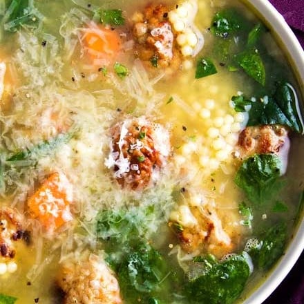 Light and filling, this Italian Wedding Soup is perfectly delicious comfort food, all year round.  Made in one pan, and ready in 30 minutes, this recipe is great for a weeknight meal! #soup #souprecipe #Italianweddingsoup #onepot #30minutemeal #weeknight #dinner #easyrecipe #homemaderecipe