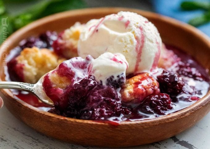 This easy summer blackberry cobbler is made with fresh berries and a sweet biscuit-like topping! Top with ice cream and enjoy! #cobbler #dessert #easyrecipe #blackberry #summerrecipe #berries #homemade