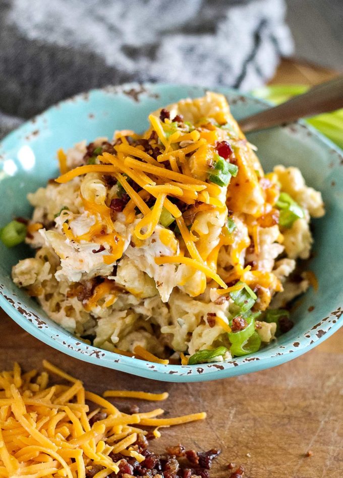 Bowl of crockpot crack chicken pasta topped with cheese