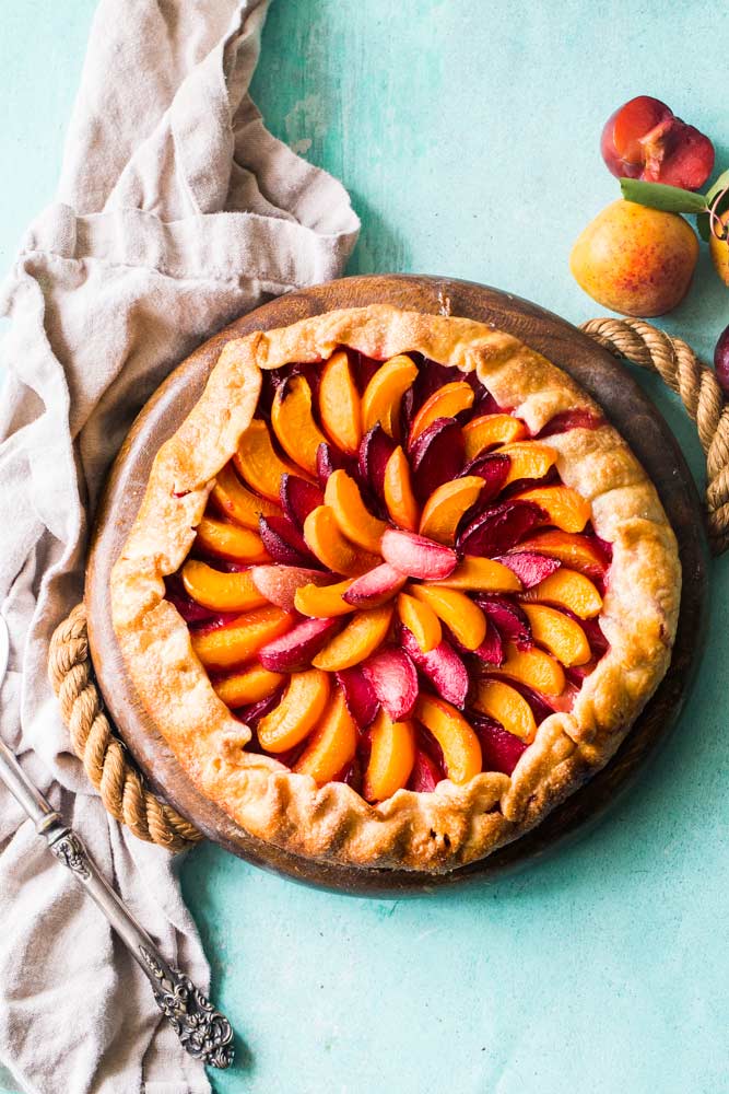 Homemade stone fruit galette on table