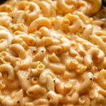 Slow Cooker Mac and Cheese is ultra creamy, and SO easy!  No boiling pasta, no velveeta, and no condensed soups needed.  Perfect side dish or kid-friendly dinner option! #macandcheese #macaroniandcheese #crockpot #slowcooker #easyrecipe #sidedish #potluck #holiday