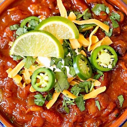 Incredibly flavorful and hearty, this 3 bean chili is made in the Instant Pot and ready in no time!  Vegetarian chili is perfect for game day, tailgating, and weeknight dinners! #chili #vegetarian #instantpot #crockpot #slowcooker #beans #party #gameday