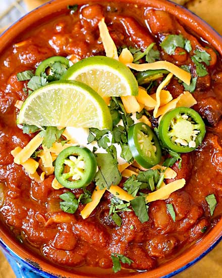 Incredibly flavorful and hearty, this 3 bean chili is made in the Instant Pot and ready in no time!  Vegetarian chili is perfect for game day, tailgating, and weeknight dinners! #chili #vegetarian #instantpot #crockpot #slowcooker #beans #party #gameday