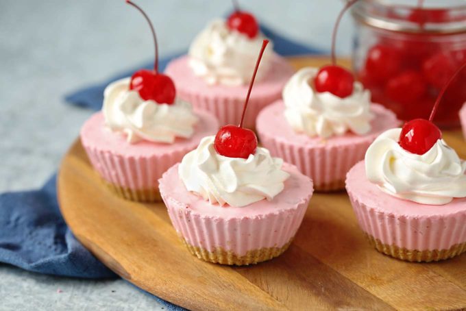 Rich and easy to make, this individual no-bake cherry cheesecake recipe is perfect for beginners and experts alike.  Just 8 simple, common ingredients, and about 10 minutes of hands-on work! #cheesecake #nobake #dessert #cherry #minidessert #individualdessert #party #easydessert