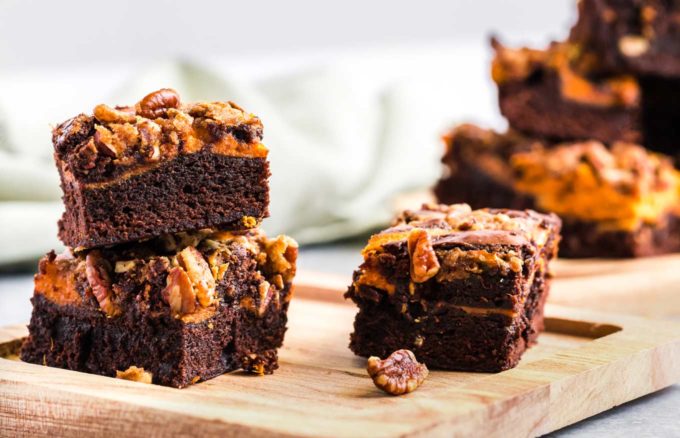 Pumpkin cheesecake brownies on cutting board