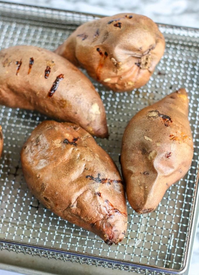Air fryer baked sweet potatoes on rack