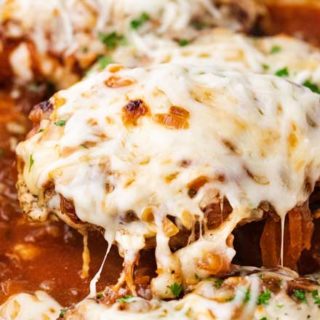Juicy chicken breasts absolutely smothered in saucy caramelized onions and loads of gooey cheese! French onion baked chicken is easy to prep ahead too! #bakedchicken #frenchonion #chicken #comfortfood #dinnerrecipe #easyrecipe
