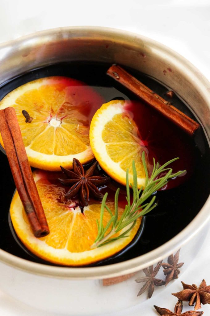 Simple and easy to make, this Mulled Wine recipe is absolutely the perfect thing to make you feel all warm and cozy as the temperature drops outside this winter! #wine #drink #cocktail #mulledwine #holiday #party #slowcooker #crockpot