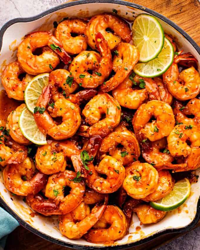 Irresistible seared shrimp glazed in a mouthwatering garlicky, sweet and spicy sauce.  The perfect 15 minute, one pan meal for a hassle-free weeknight dinner!  Serve this shrimp recipe with pasta, rice, or veggies to round out the meal.  And seriously, this sauce is finger lickin' good, and great on chicken or pork too!