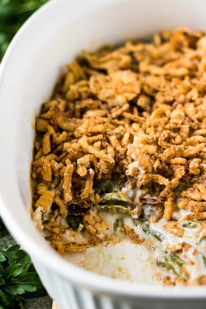 Green bean casserole in white baking dish