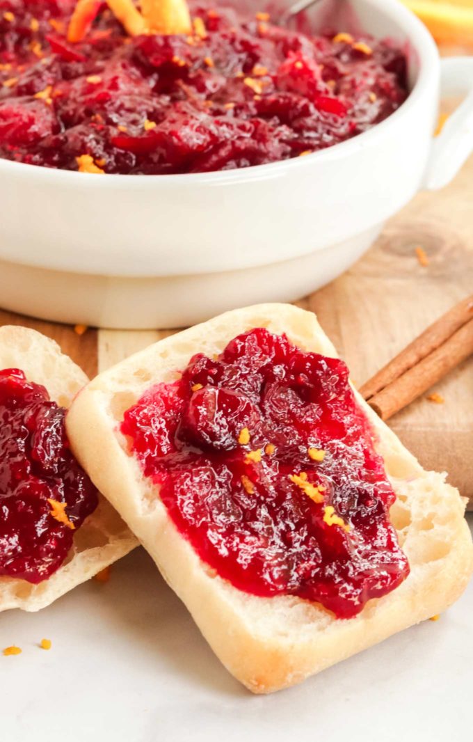 Homemade cranberry sauce on dinner roll