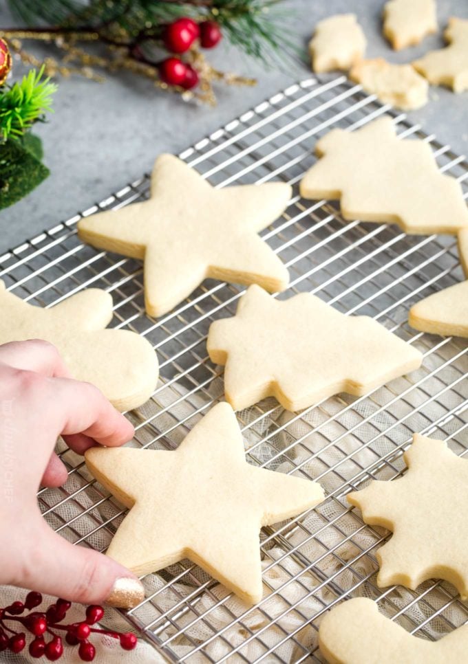 Cut out sugar cookies on cooling rack