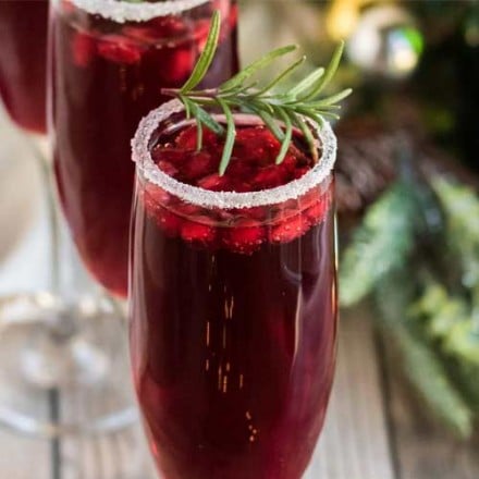 Refreshing and so quick and easy to make, these Pomegranate Mimosas are great for brunch, or a holiday party!  Tips on other flavor variations and how to make a pitcher for a large crowd! #mimosas #brunch #pomegranate #champagne #sparkling #holiday #cocktail #drinkrecipe