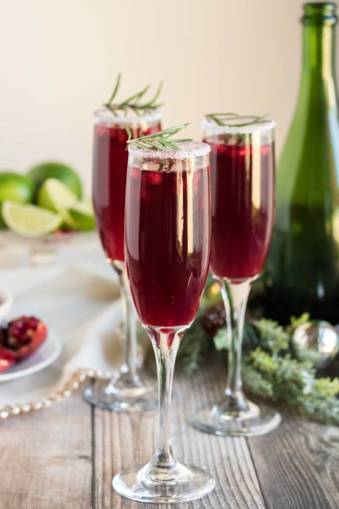 Refreshing and so quick and easy to make, these Pomegranate Mimosas are great for brunch, or a holiday party!  Tips on other flavor variations and how to make a pitcher for a large crowd! #mimosas #brunch #pomegranate #champagne #sparkling #holiday #cocktail #drinkrecipe