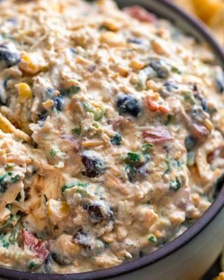 Loaded with bold flavors, this Southwestern Chicken Taco Dip is crazy addicting and always a crowd-pleaser! Perfect to make-ahead and no-bake, which means you can be party ready in no time! #tacodip #chicken #makeaheadrecipe #dip #partyfood #appetizer #southwestern #nobake