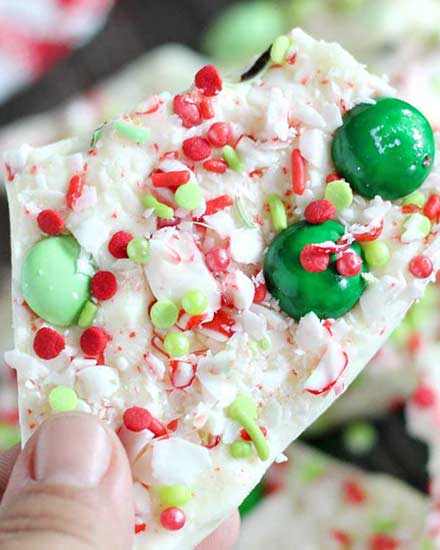 Holiday Peppermint Bark - the easiest, no-bake dessert made using simple ingredients like white chocolate and candy canes, and SO easy to customize for any holiday!  Great for Christmas dessert trays or to give away as holiday gifts! #dessert #nobake #easyrecipe #holiday #Christmas #peppermint #bark #white chocolate