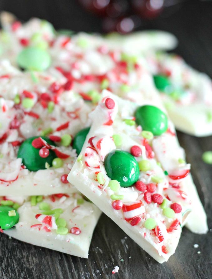 Holiday Peppermint Bark - the easiest, no-bake dessert made using simple ingredients like white chocolate and candy canes, and SO easy to customize for any holiday!  Great for Christmas dessert trays or to give away as holiday gifts! #dessert #nobake #easyrecipe #holiday #Christmas #peppermint #bark #white chocolate