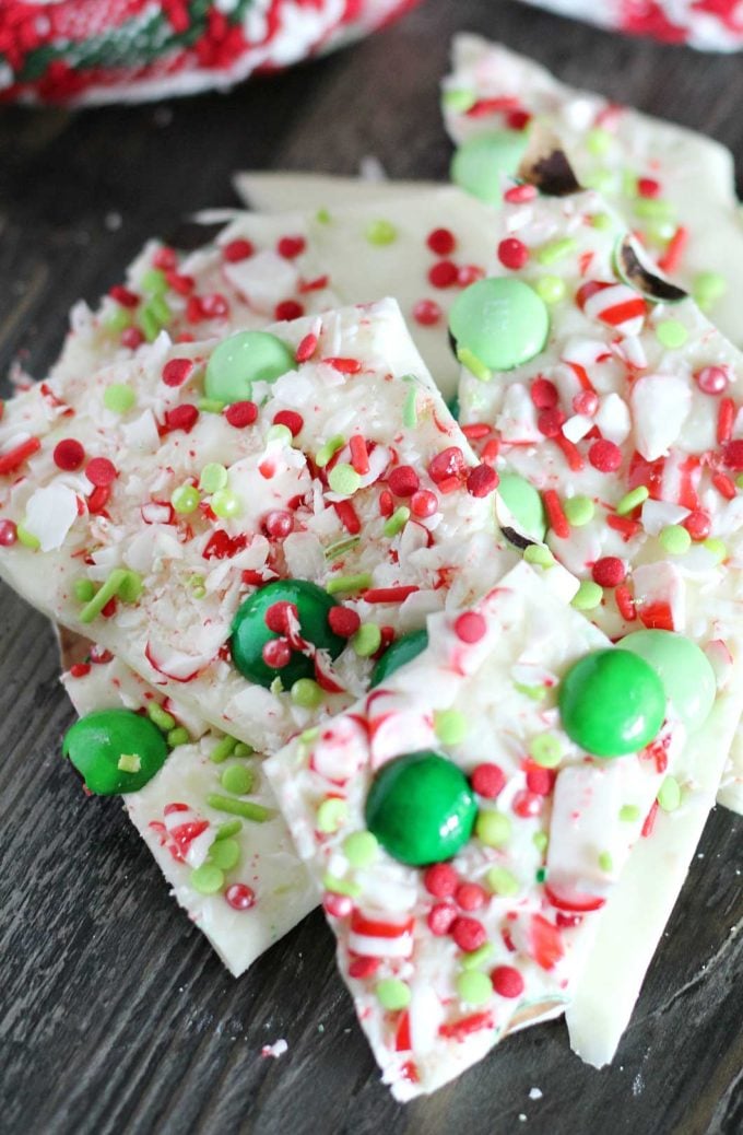 Holiday Peppermint Bark - the easiest, no-bake dessert made using simple ingredients like white chocolate and candy canes, and SO easy to customize for any holiday!  Great for Christmas dessert trays or to give away as holiday gifts! #dessert #nobake #easyrecipe #holiday #Christmas #peppermint #bark #white chocolate