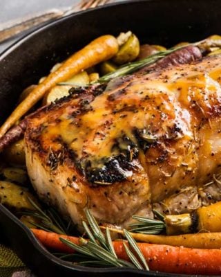 This Maple Mustard Roasted Pork Loin is SO moist and flavorful, you'll definitely want seconds! A simple brine gives the pork such great flavor and texture. Perfect for a holiday or weekend dinner! #porkloin #pork #roasted #brine #maple #mustard #holidaydinner #weekenddinner #easyrecipe