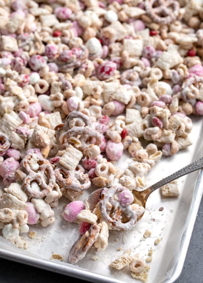 White trash chex mix on baking sheet broken up into pieces