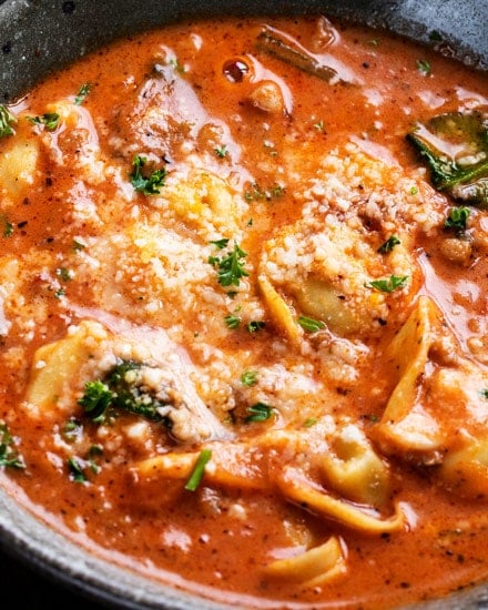 This sausage and tortellini soup is a bowl full of absolute comfort!  It's loaded with bold flavors, plenty of sausage and cheese-filled pasta, and there's only 5 minutes of pressure cooking time! #tortellini #soup #sausage #Italian #instantpot #pressurecooker #instapot #easyrecipe #dinner