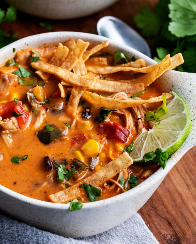 Bowl of tortilla soup with toppings