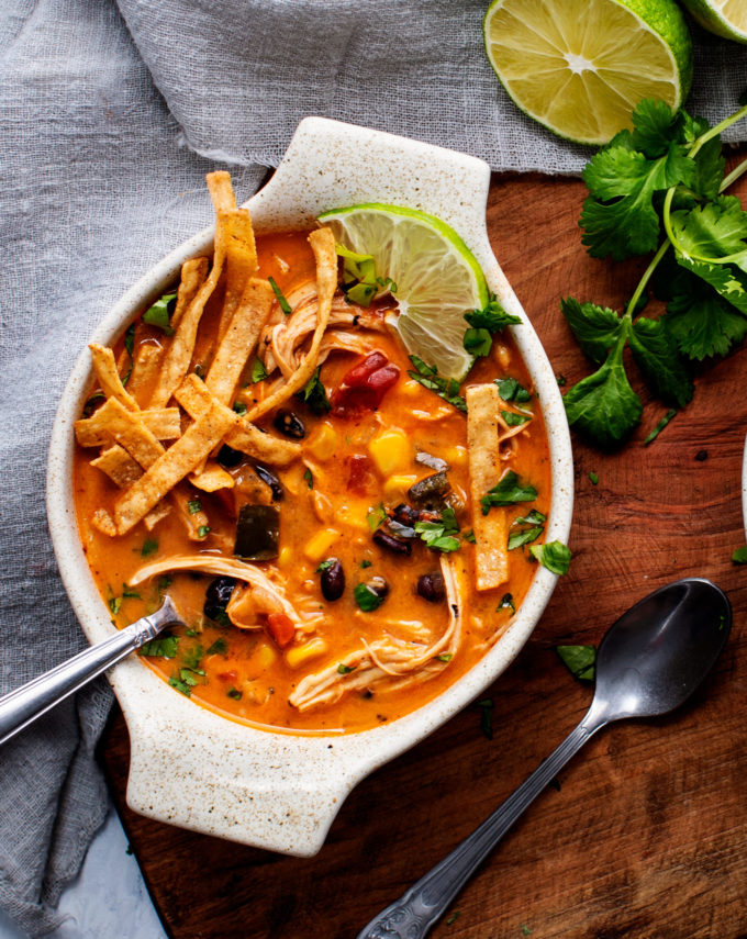 Bowl of soup on wood platter