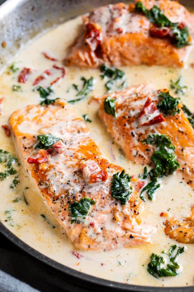 Tuscan salmon in cream sauce in skillet