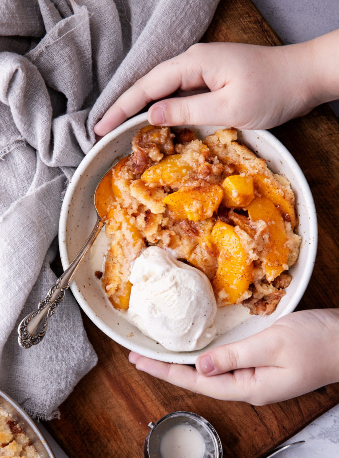 Holding bowl of dessert