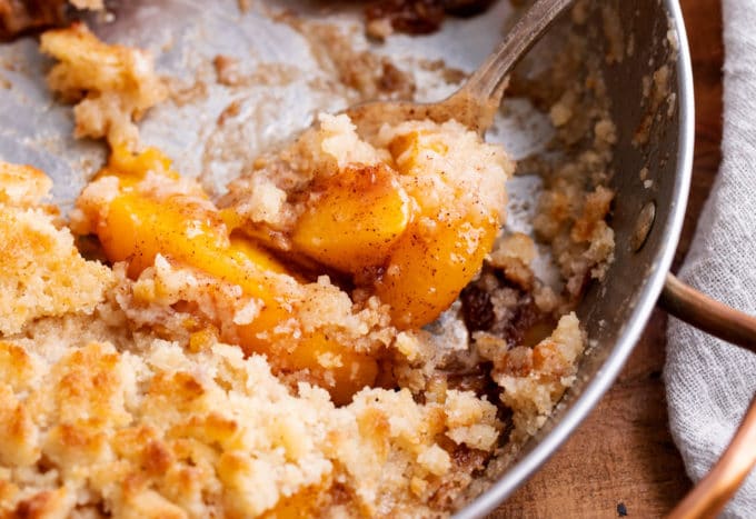 Scoop of peaches in skillet