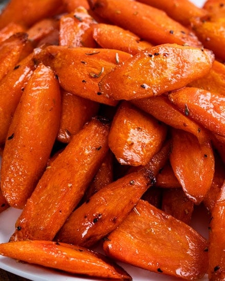 Classic roasted carrots recipe, perfectly tender and lightly caramelized, then tossed with a honey and browned butter sauce!  Great as a holiday side dish!! #carrots #roasted #vegetable #veggies #holiday #easter #thanksgiving #easyrecipe #sidedish