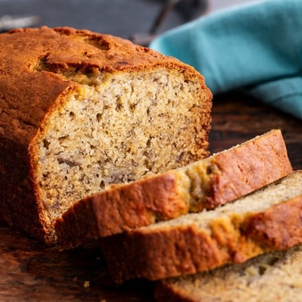 Loaf of banana bread partially sliced