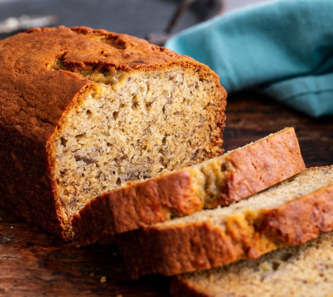 Loaf of banana bread partially sliced