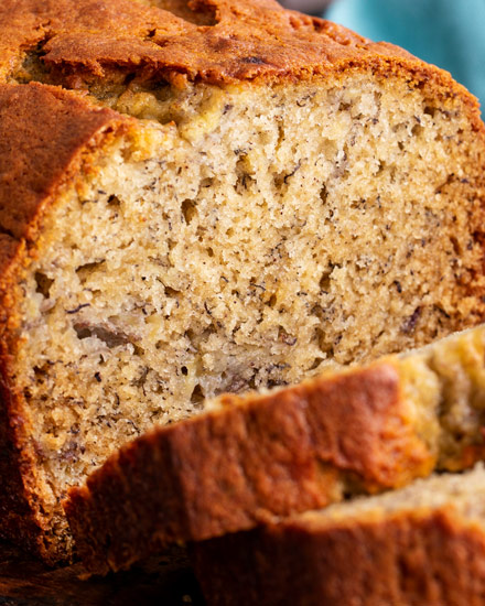 This Classic Banana Bread is ultra moist and tender, and a fantastic way to use up extra bananas!  Made with no mixer, in 1 bowl, and ready in 1 hour... it's the perfect easy quick bread recipe! #banana #bananabread #baking #bread #quickbread #loaf #easyrecipe #dessert